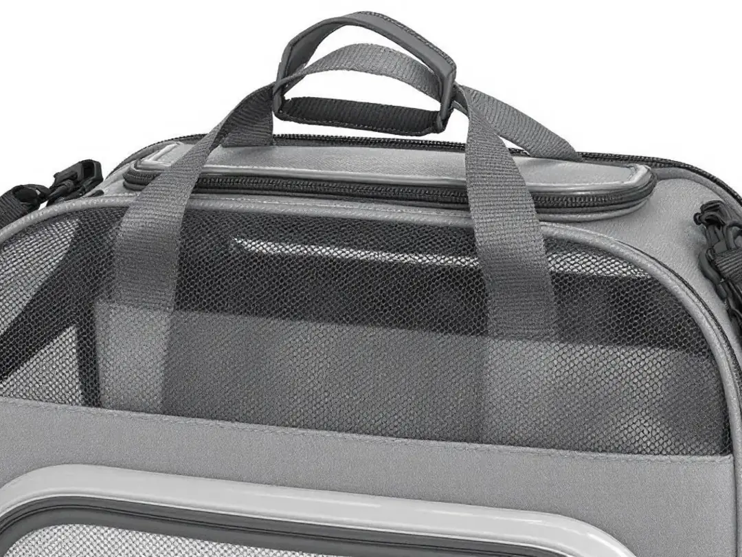 A small pet travel carrier specifically designed for tiny dogs, featuring a cozy interior and secure zippers, perfect...